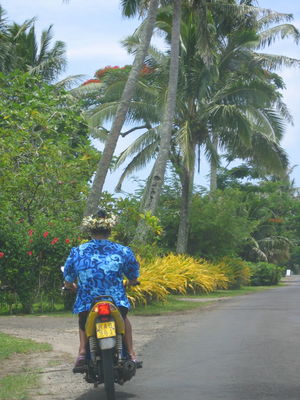 Lady on scooter, Rarotonga

