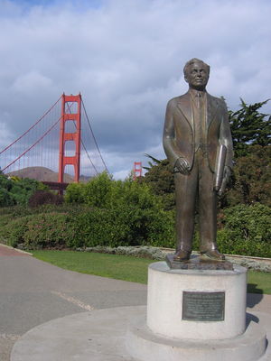 The Golden Gate Bridge and a statue of its designer
