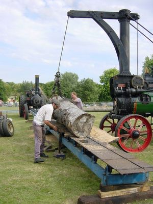 Sawing logs with steam power
