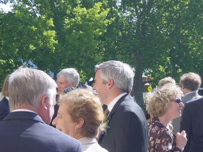Neil mingles with the guests at his wedding
