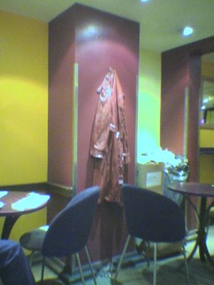 Costa Coffee at Paddington Station
Has very strange decor, with a coat (and fallen glove) as part of the wall moulding

