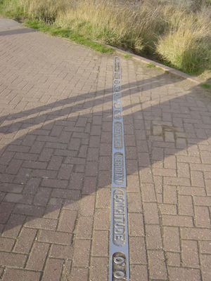 Meridian Line in Cleethorpes
When the marine embankment was built between Cleethorpes Boating Lake and the sand dunes at Humberston Fitties in the early 1930's a metal plate was set in the pathway. It was presented by Sheffield Foundry and marks where the Greenwich Meridian divides the earth into East and West.
