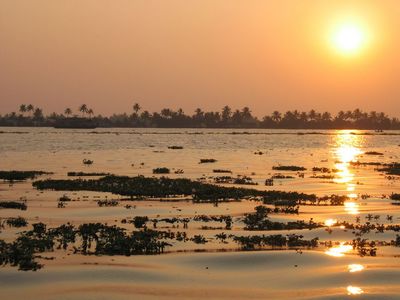 Sunset over Kayamkulam Lake in Kerala backwaters

